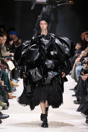 COMME DES GARÇONS - 2024 Faux leather skirt with volumes and cutouts showing off sheer underlayer