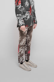 COMME DES GARCONS HOMME PLUS - SS06 "Rip&Tongue" Faded pants with all over pattern of the Rolling Stones logo (runway)