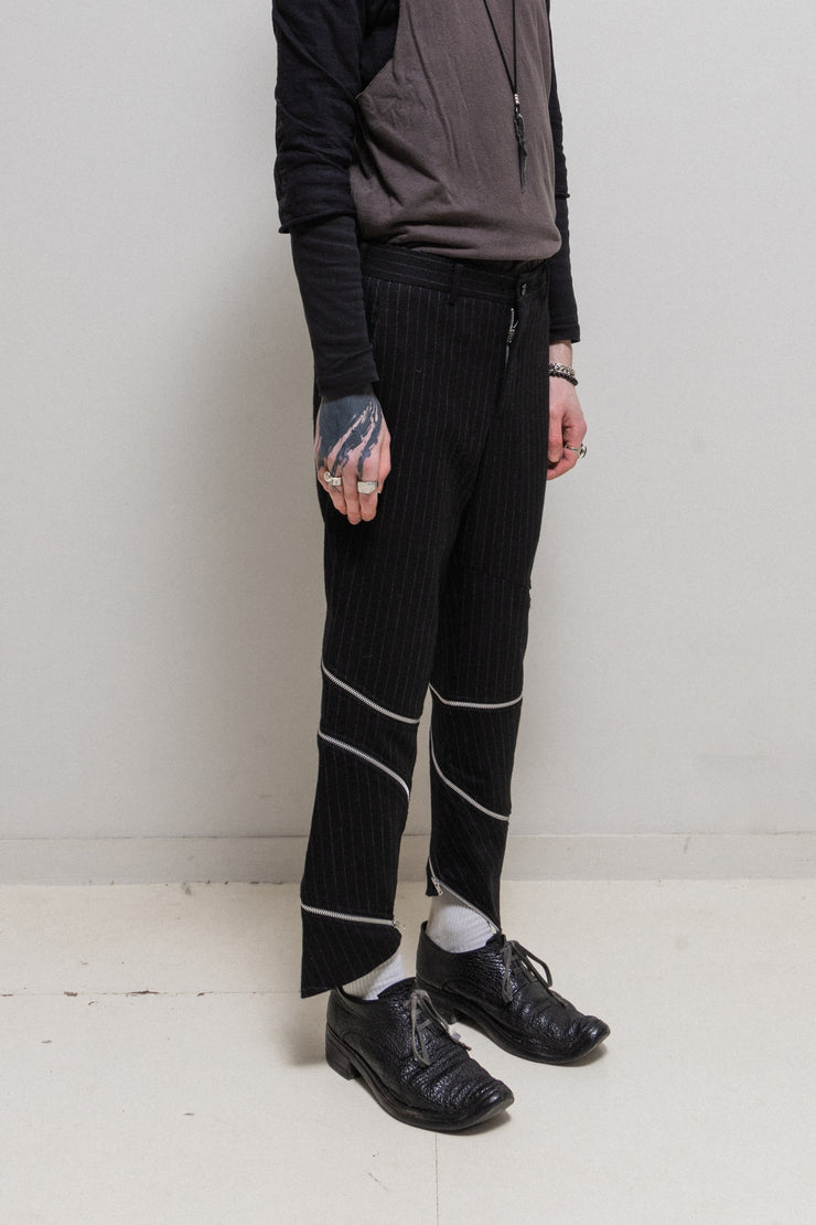 COMME DES GARCONS HOMME PLUS - FW18 "White Shock" Wool pinstripe pants with spiral leg zippers (runway)