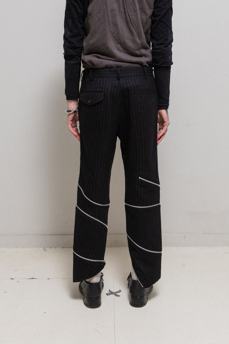 COMME DES GARCONS HOMME PLUS - FW18 "White Shock" Wool pinstripe pants with spiral leg zippers (runway)