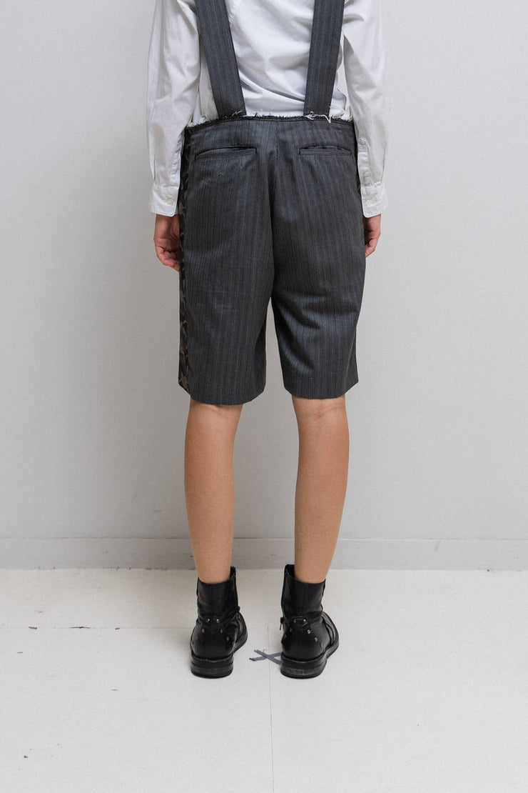 COMME DES GARÇONS HOMME PLUS - SS15 « Soldier of Peace » Striped shorts with camo details and suspenders