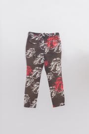 COMME DES GARCONS HOMME PLUS - SS06 "Rip&Tongue" Faded pants with all over pattern of the Rolling Stones logo (runway)