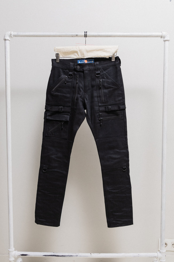 BLACKMEANS - Thick cotton pants with flap pockets, zippers and strap details