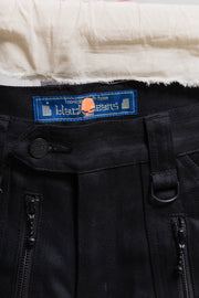 BLACKMEANS - Thick cotton pants with flap pockets, zippers and strap details