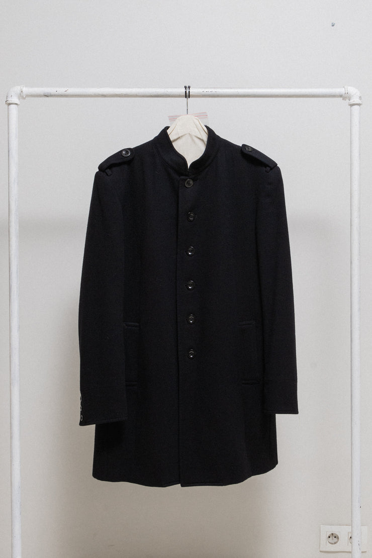 YOHJI YAMAMOTO POUR HOMME - FW07 Officer wool coat with back buttoning creating a slit (runway)