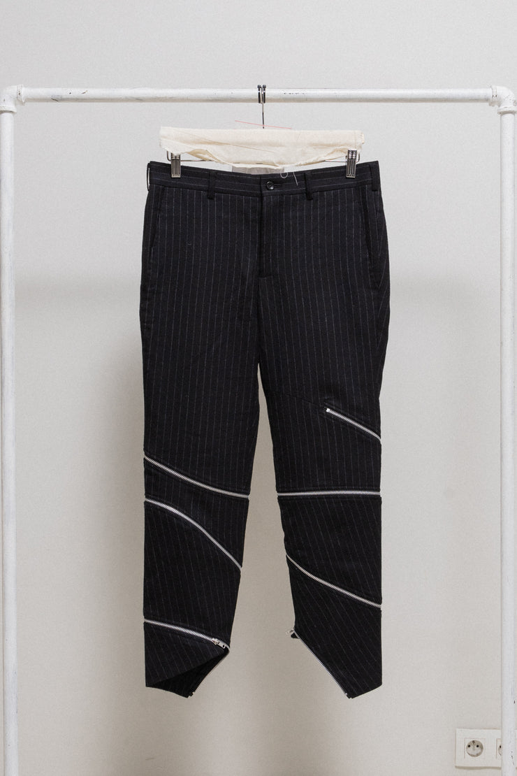 COMME DES GARCONS HOMME PLUS - FW18 "White Shock" Wool pinstripe pants with spiral leg zippers (runway)