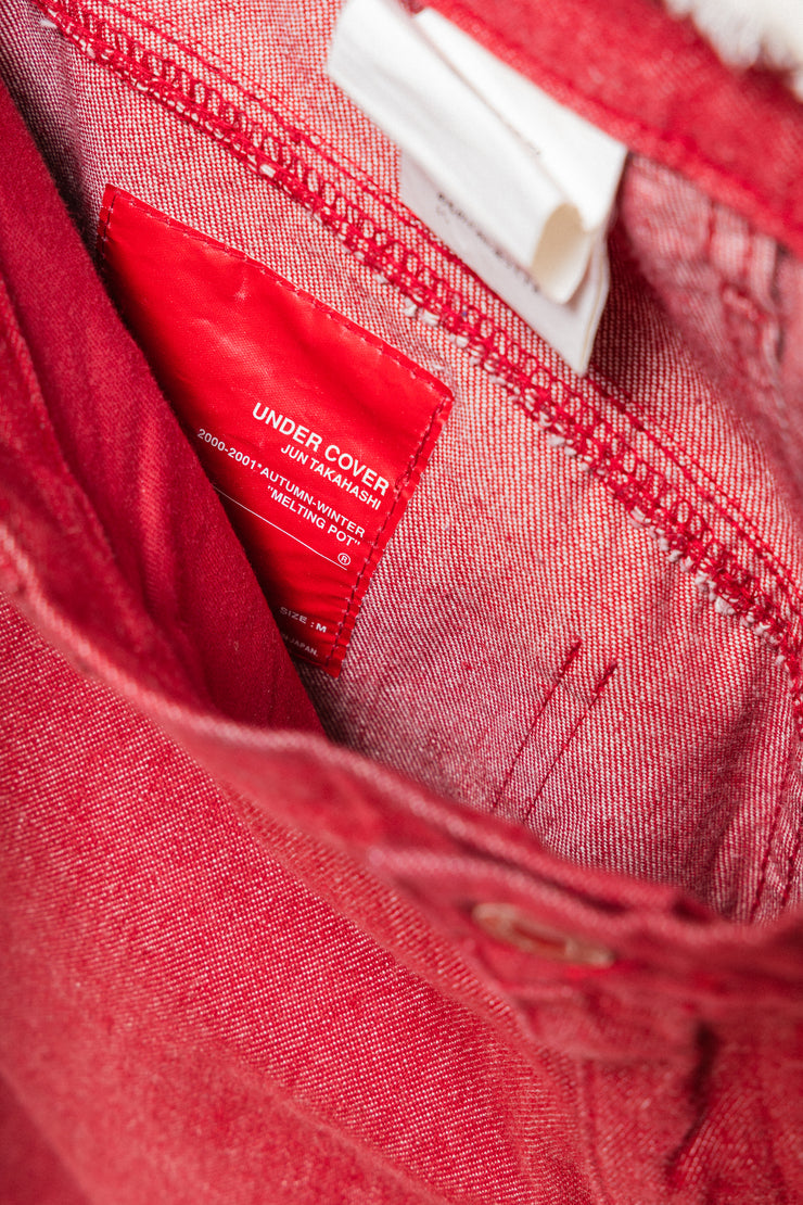 UNDERCOVER - FW00 "Melting Pot" Red slim jeans with star knee patches