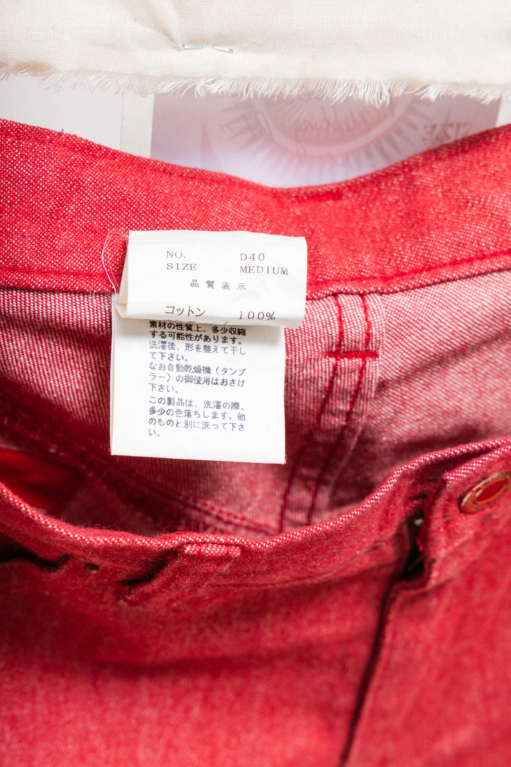 UNDERCOVER - FW00 "Melting Pot" Red slim jeans with star knee patches