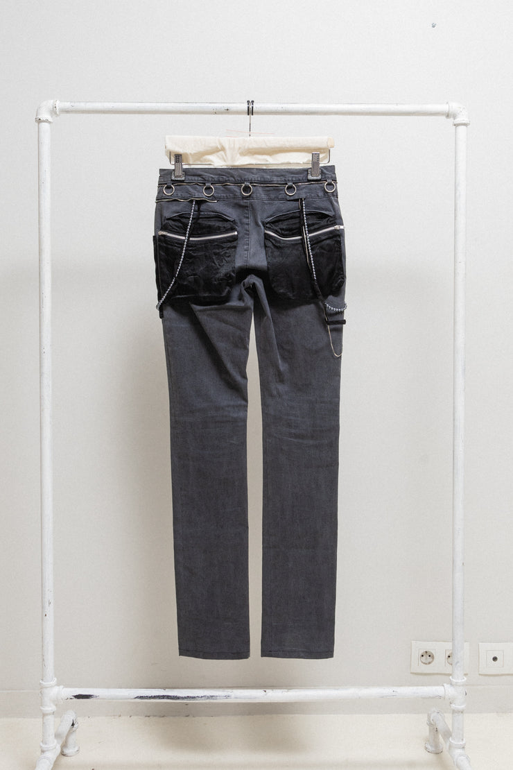 UNDERCOVER - SS03 "SCAB" Slim pants with embellishment details and flap pockets (runway)