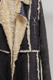 UNDERCOVER - FW02 “Witch’s cell division” Long shearling leather coat with waist straps and pocket detail