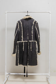UNDERCOVER - FW02 “Witch’s cell division” Long shearling leather coat with waist straps and pocket detail
