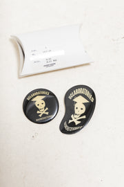 UNDERCOVER - SS04 « Languid » Set of two metal badges (skull)