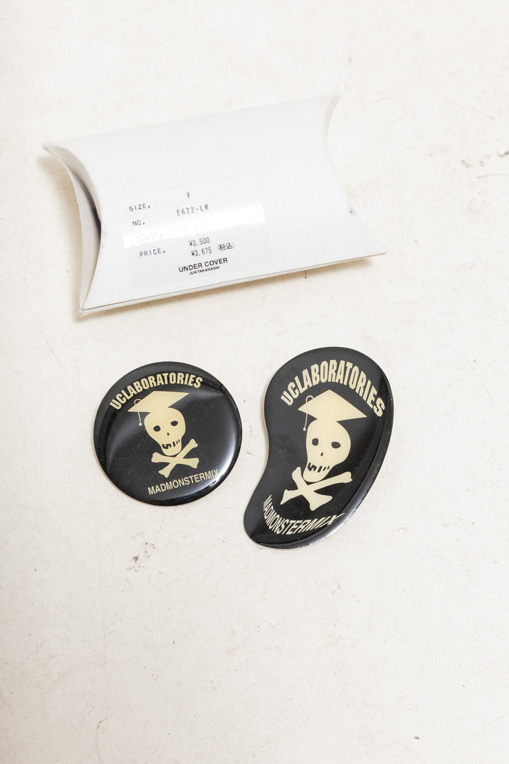 UNDERCOVER - SS04 « Languid » Set of two metal badges (skull)
