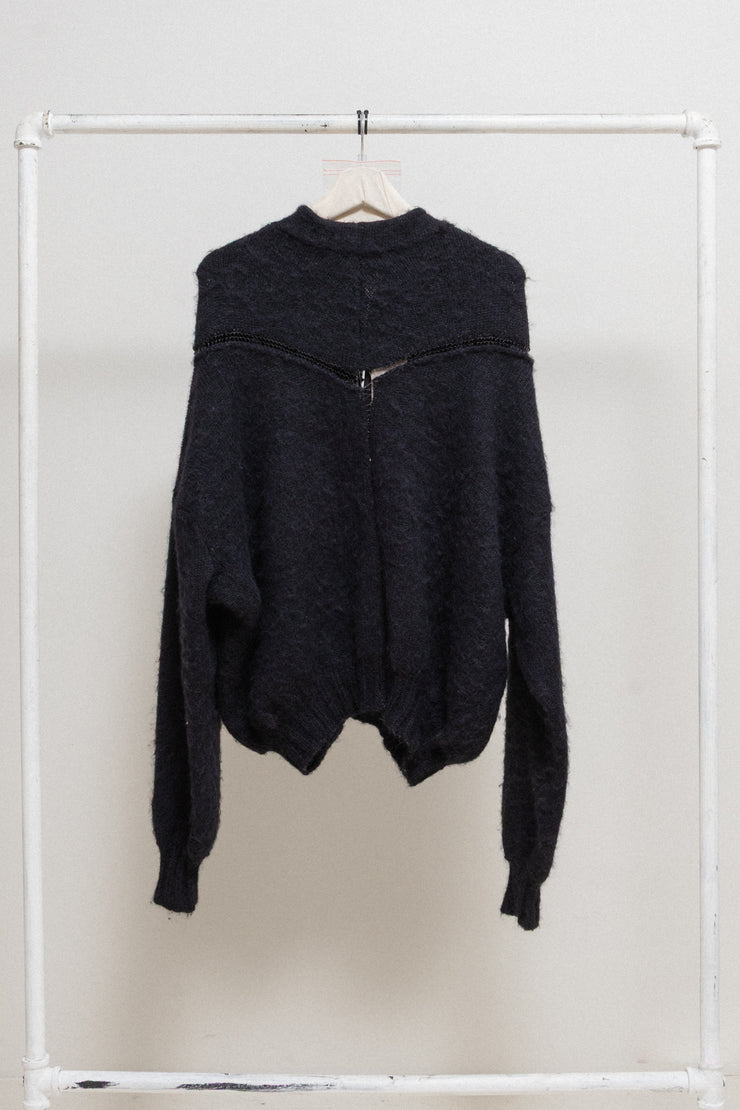 FREDERIK LIEDERLEY - Wool sweater with extra long sleeves and loose knitting details