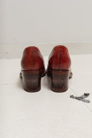 CHEREVICHKIOTVICHKI - Blood red leather pumps with curved heels