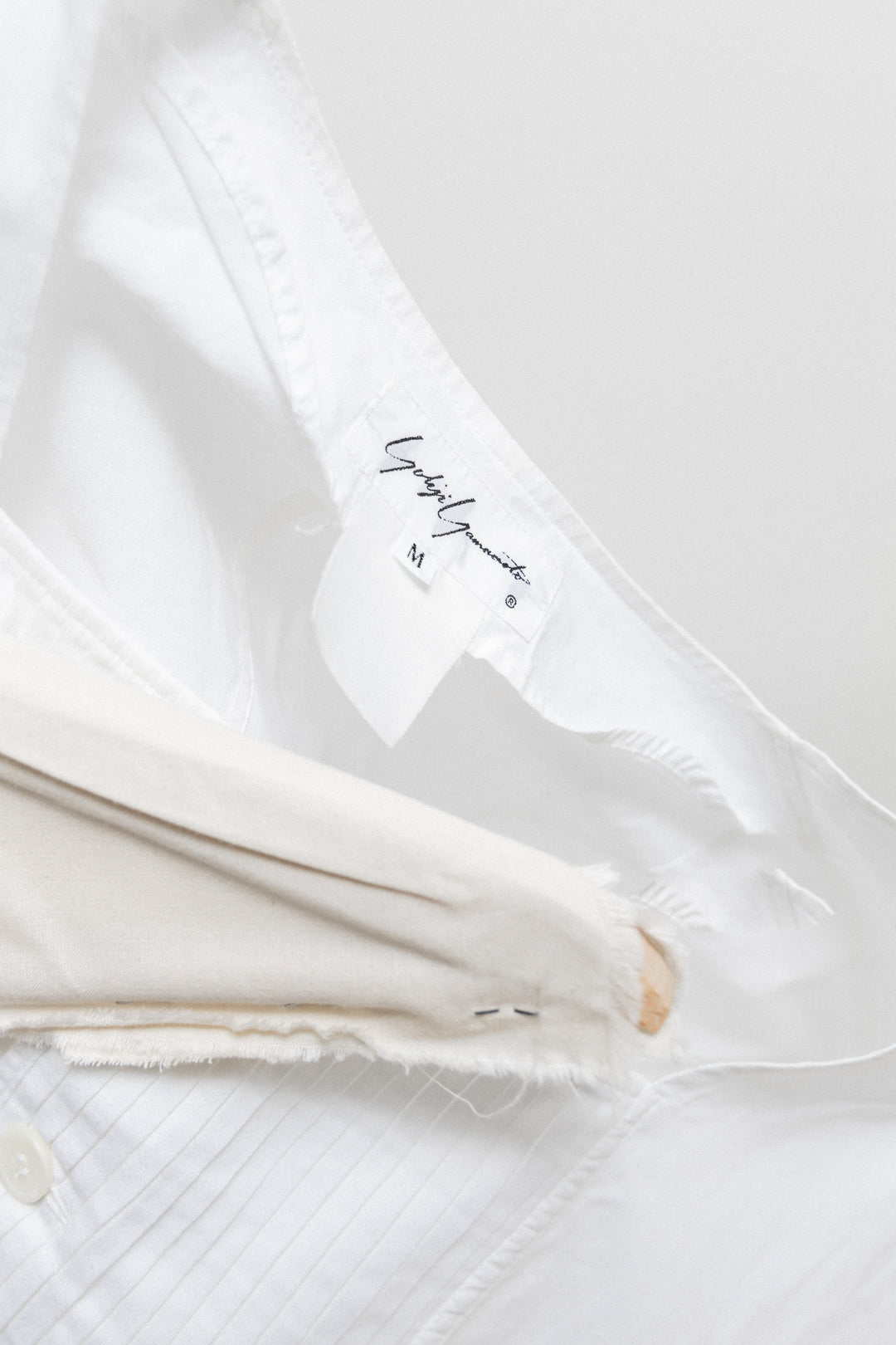YOHJI YAMAMOTO - Cotton top with pleated panel and half cut
