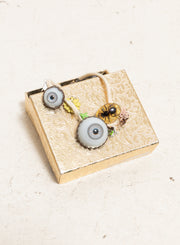 UNDERCOVER - SS05 « But Beautiful II » Glass monster eye ankle bracelet with bee in amber charm and metal flowers (runway)