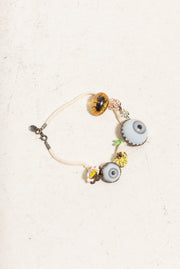 UNDERCOVER - SS05 « But Beautiful II » Glass monster eye ankle bracelet with bee in amber charm and metal flowers (runway)