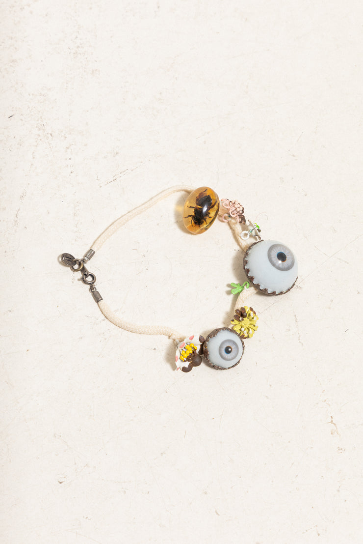 UNDERCOVER - SS05 « But Beautiful II » Glass monster eye ankle bracelet with bee in amber charm and metal flowers (runway)