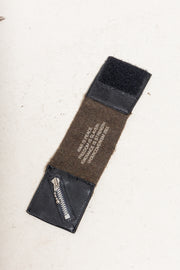 UNDERCOVER - FW03 "Paper Doll" Wool and leather bracelet, from George Orwell's 1984' famous quote