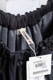 COMME DES GARÇONS - 2024 Faux leather skirt with volumes and cutouts showing off sheer underlayer