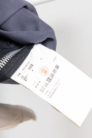 COMME DES GARÇONS - 2024 Faux leather top with voluminous front frills