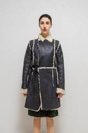 UNDERCOVER - FW02 “Witch’s cell division” Long shearling leather coat with waist straps and pocket detail