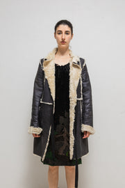 UNDERCOVER - FW02 “Witch’s cell division” Long shearling leather coat with waist straps and pocket detail