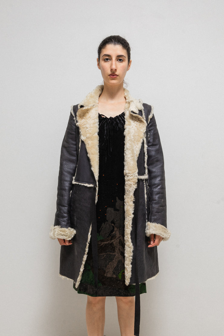 UNDERCOVER - FW02 “Witch’s cell division” Long shearling leather coat with waist straps and pocket detail