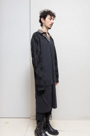 BLACKMEANS - Extra long cotton jacket with patchwork sleeves and hood