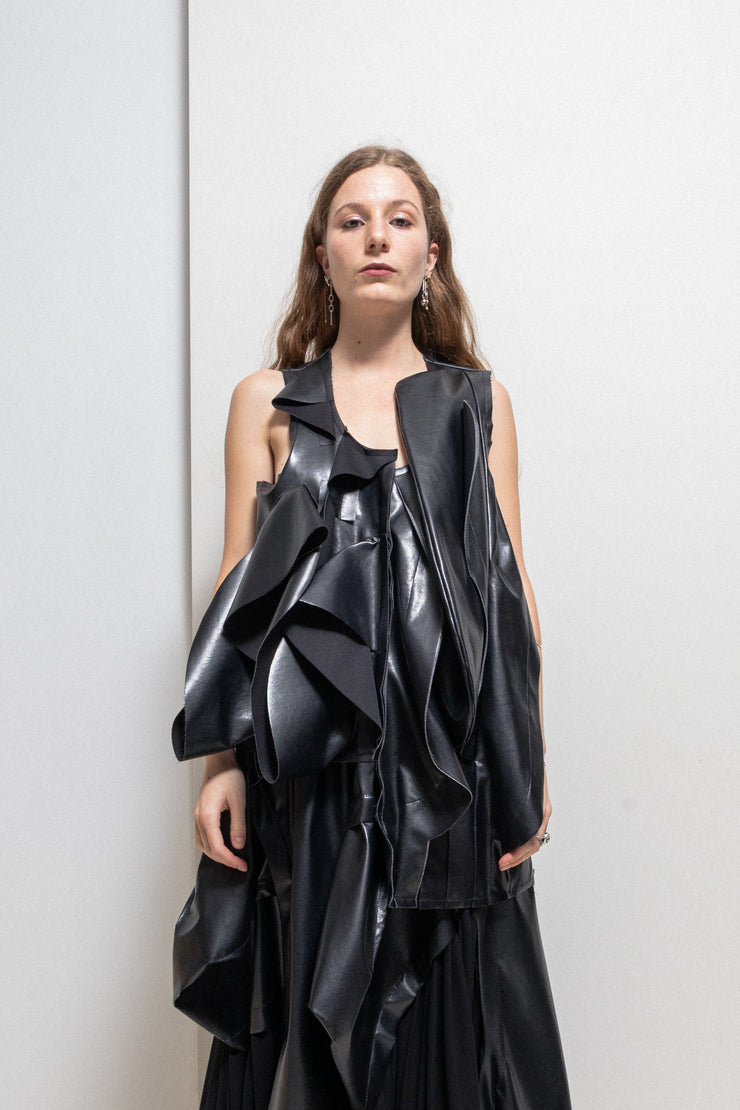 COMME DES GARÇONS - 2024 Faux leather top with voluminous front frills