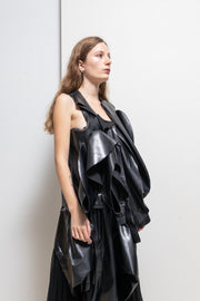 COMME DES GARÇONS - 2024 Faux leather top with voluminous front frills