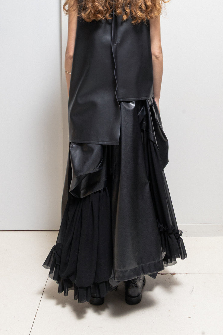 COMME DES GARÇONS - 2024 Faux leather skirt with volumes and cutouts showing off sheer underlayer